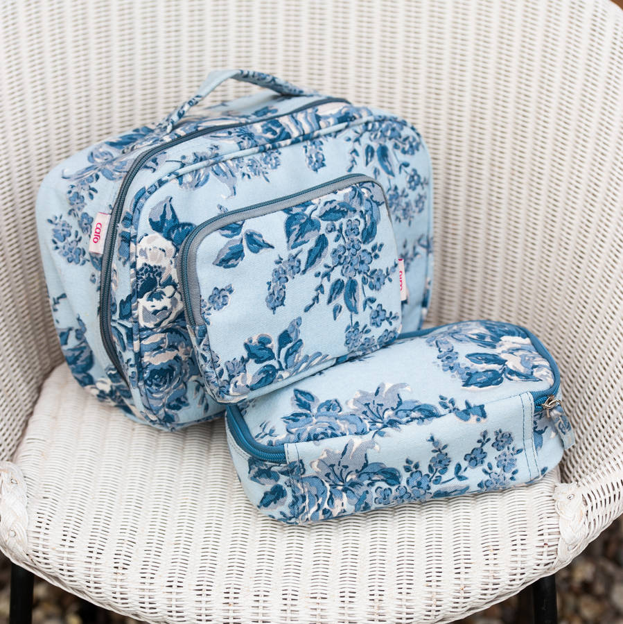 canvas wash and make up bags in blue rosetta print by caro london