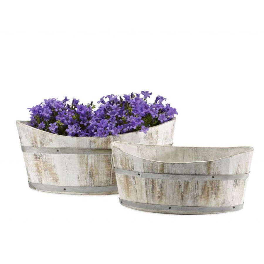 white washed boat shaped planters by garden selections 