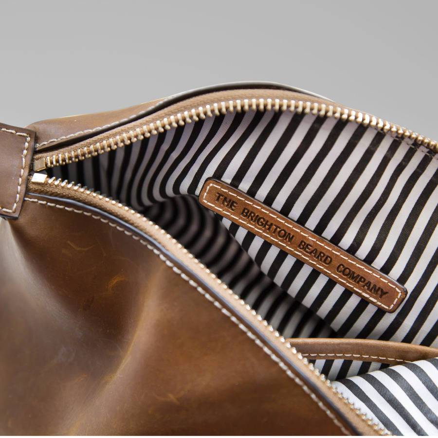 leather wash bag with embossed anchor logo by the brighton beard