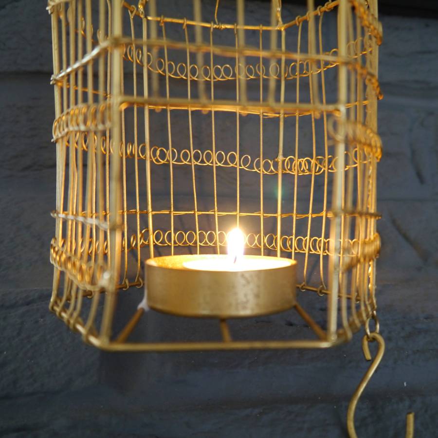 brass birdcage hanging tealight holder by deservedlyso