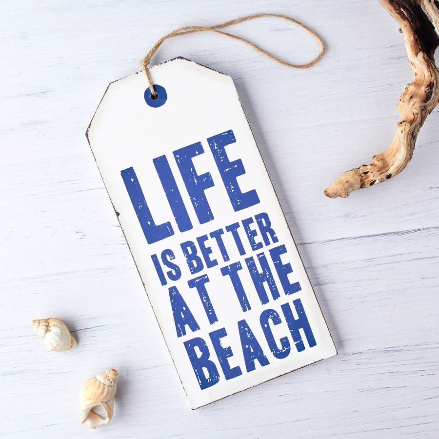 oversized wooden nautical tag sign by the contemporary home
