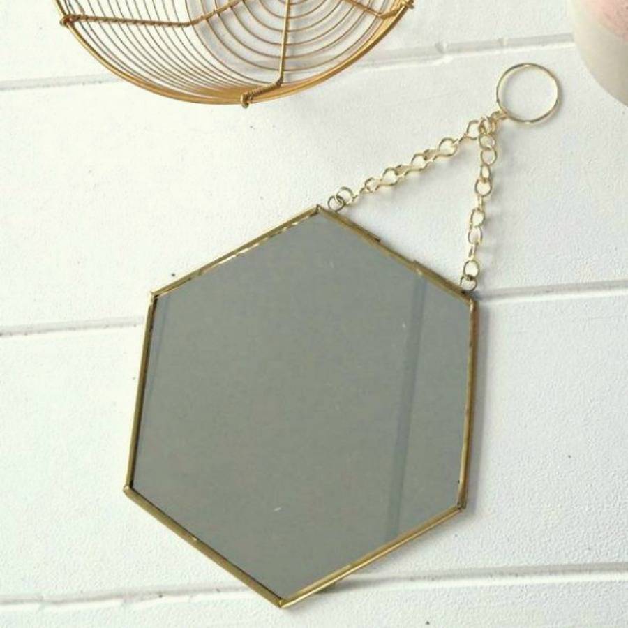 small hexagon shaped brass mirror by posh totty designs interiors