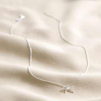 Tiny Pearl Bow Pendant Necklace, 8 of 9