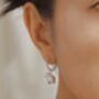 White Enamel Lily And Pearl Huggie Hoop Earrings, thumbnail 2 of 7