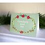 Joyous Botanical Wreath Christmas Card. On Green, thumbnail 1 of 2