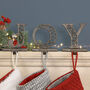 Set Of Three Joy Christmas Stocking Hangers, thumbnail 1 of 6