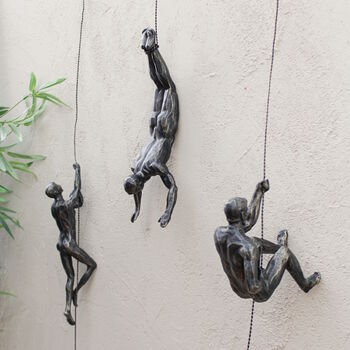 bronze abseiling figures