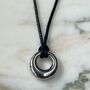 Mini Donut Charm Pendant In Silver On Black Cord Necklace, thumbnail 1 of 3