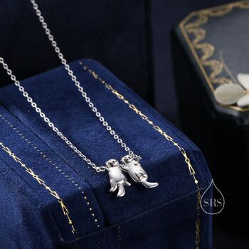 Tiny Otter Holding Hands Necklace, 2 of 12