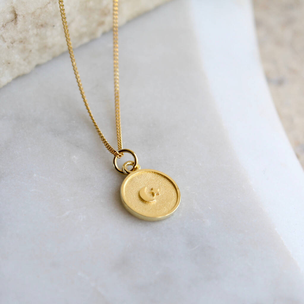 gold vermeil necklace with moon and star medallion by lime tree design