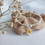 Sterling Silver Daisy Flower Charm Stretch Bracelet, thumbnail 1 of 4