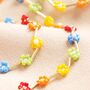 Multicoloured Daisy Beaded Necklace In Gold, thumbnail 1 of 5