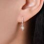 Sterling Silver Tiny Starburst Huggie Hoop Earrings, thumbnail 1 of 10