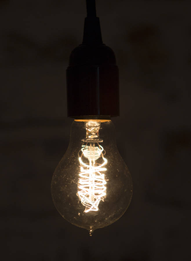 exposed filament light bulb by lime tree london