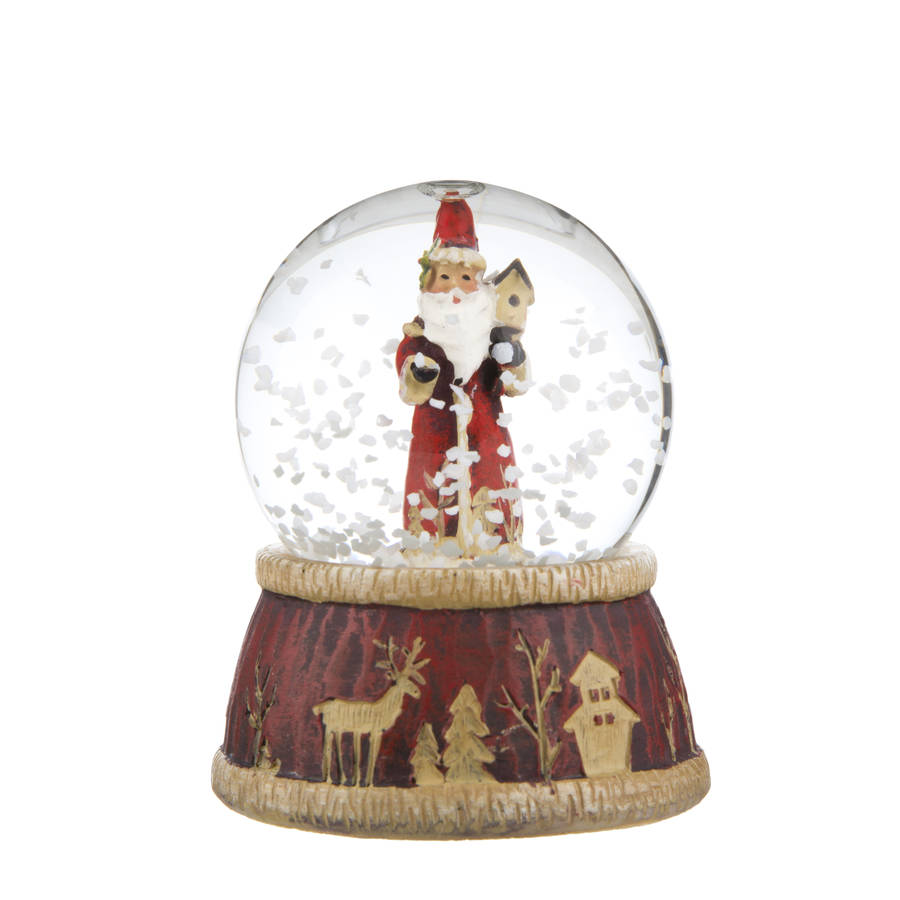 traditional santa snow globe by the christmas home | notonthehighstreet.com