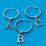 Teeny Capital Letter Hoop Earring In Sterling Silver, thumbnail 1 of 6