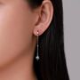 Sterling Silver Dangling Starburst Huggie Hoop Earrings, thumbnail 6 of 11