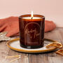 Festive Spice Scented Large Amber Glow Through Candle, thumbnail 1 of 10