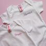 Hand Embroidered Baby Name Personalised Baby Grow, thumbnail 1 of 8