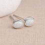 Oval Sterling Silver White Opal Stud Earrings – 6mm X 4mm, thumbnail 1 of 6