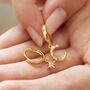 Crescent Moon And Star Huggie Hoops In Gold Plating, thumbnail 3 of 7