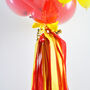 Personalised Red And Yellow Clear Bubble Balloon, thumbnail 2 of 4
