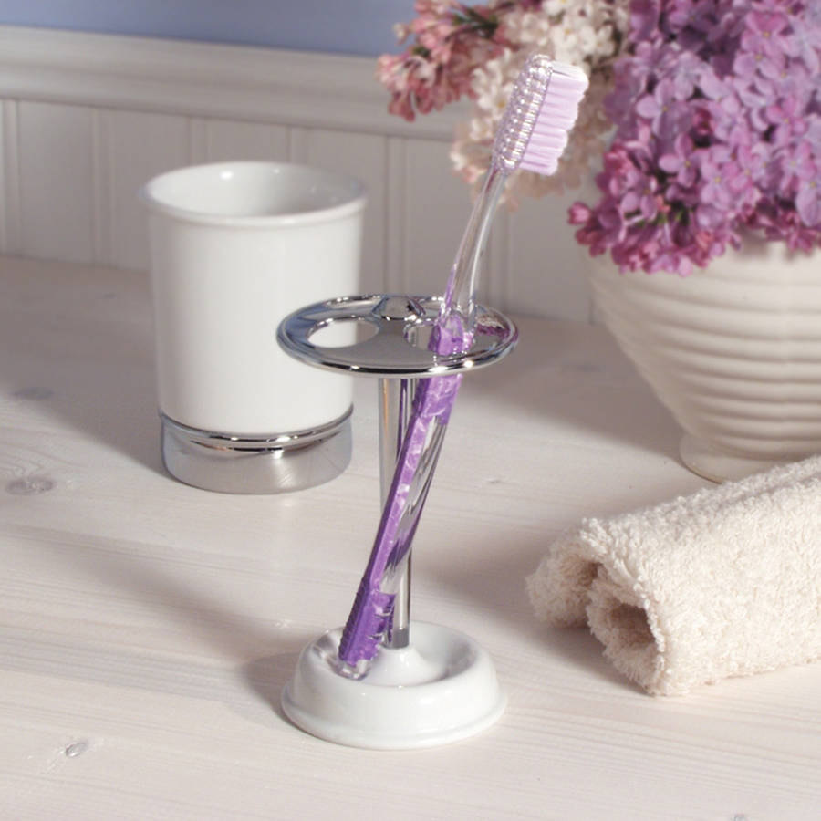 white soap dispenser and matching bathroom accessories by jodie byrne