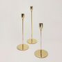 G Decor Verro Set Of Three Modern Gold Stainless Steel Candle Holders Sleek Weighted Dinner Candlesticks, thumbnail 1 of 5