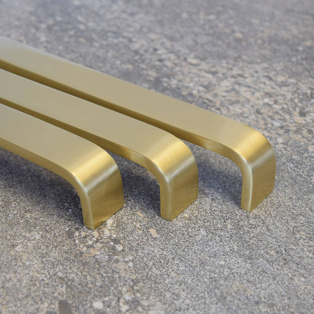 wide curved brass gold door and drawer bar pulls by pushka home