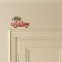 Red Car Carrying A Christmas Tree Light Decoration, thumbnail 1 of 2