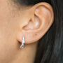 Sterling Silver Snake Knot Oval Hoop Huggie Earrings, thumbnail 1 of 9