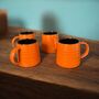 Set Of Four Reactive Glaze Brûlée Mugs In Pumpkin Orange And Brown, thumbnail 2 of 3