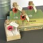 Tiny Gerbera Daisy In A Bottle With Personalised Tag, thumbnail 4 of 11