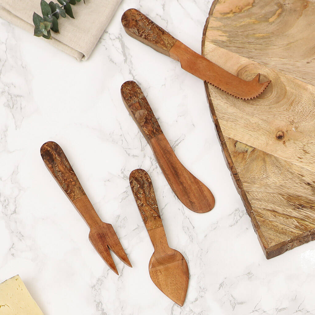 set of four carved wooden cheese knives by dibor