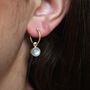 Huggie Hoops With Moonstones 9ct Gold Or Silver, thumbnail 1 of 2
