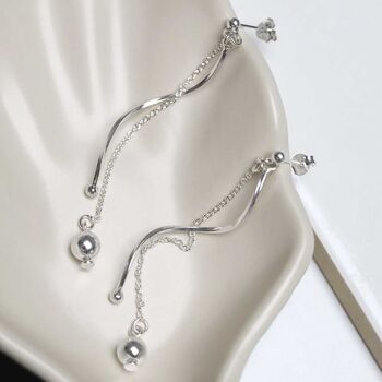 Sterling Silver Dancing Twist And Ball Stud Earrings, 2 of 7