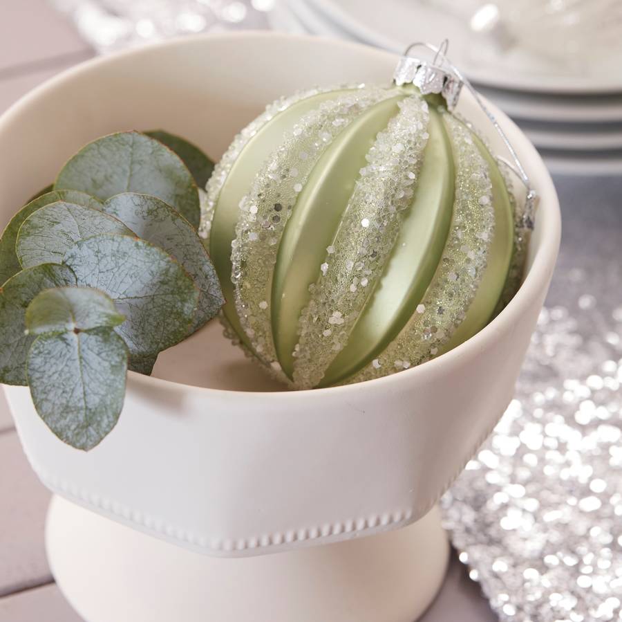 pale green christmas bauble by the christmas home