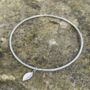 Hammered Bangle With Leaf Drop Charm, thumbnail 1 of 6