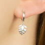 Sterling Silver Huggie Hoop Earrings With Tropical Palm Leaf Charms, thumbnail 2 of 10