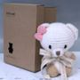 Hand Knitted Personalised Mini Teddy Bear With Bow, thumbnail 2 of 7