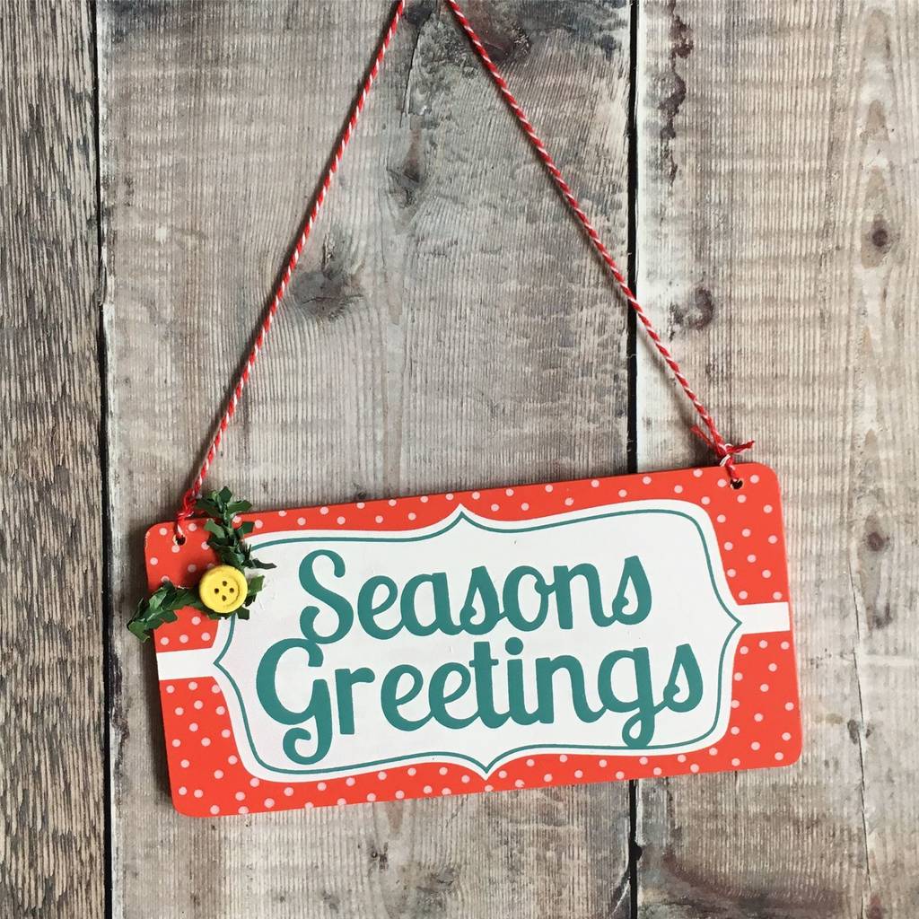 seasons greeting christmas sign by the christmas home