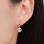 Skull Huggie Hoop Earrings In Sterling Silver, thumbnail 1 of 12