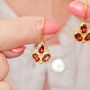 Garnet Triple Stone Gold Plated Silver Drop Earrings, thumbnail 2 of 12