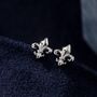Sterling Silver Fleur De Lis Flower Stud Earrings, thumbnail 1 of 10