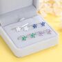 Sterling Silver Cz Flower Huggie Hoop Earrings, thumbnail 1 of 12