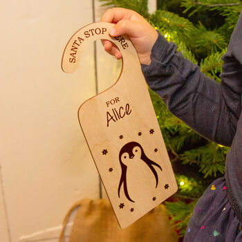 'Santa Stop Here' Personalised Penguin Door Hanger, 3 of 6