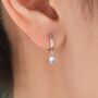 Sterling Silver Moonstone Droplet Huggie Hoop Earrings, thumbnail 1 of 11