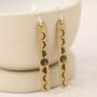 Sterling Silver And Brass Moon Phase Stick Earrings, thumbnail 1 of 4