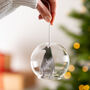 Personalised First Christmas Penguin Dome Bauble, thumbnail 1 of 3