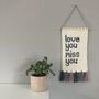 Knitted 'Love You Miss You' Wall Hanging, thumbnail 1 of 4